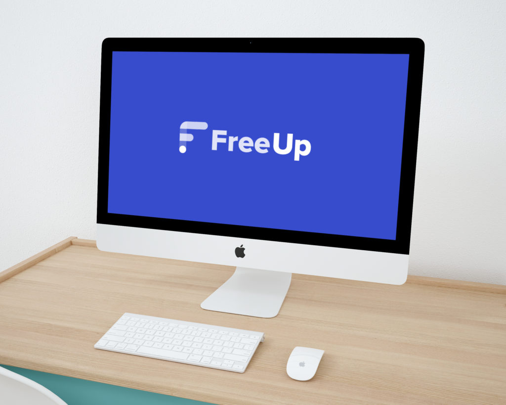 FreeUp Freelance Job Posting Site Logo on Deskop Computer