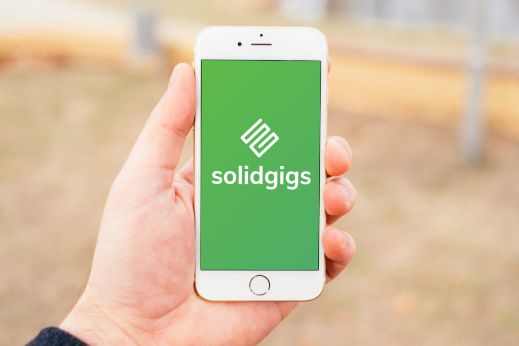 SolidGigs Freelance Job Site Logo On Phone