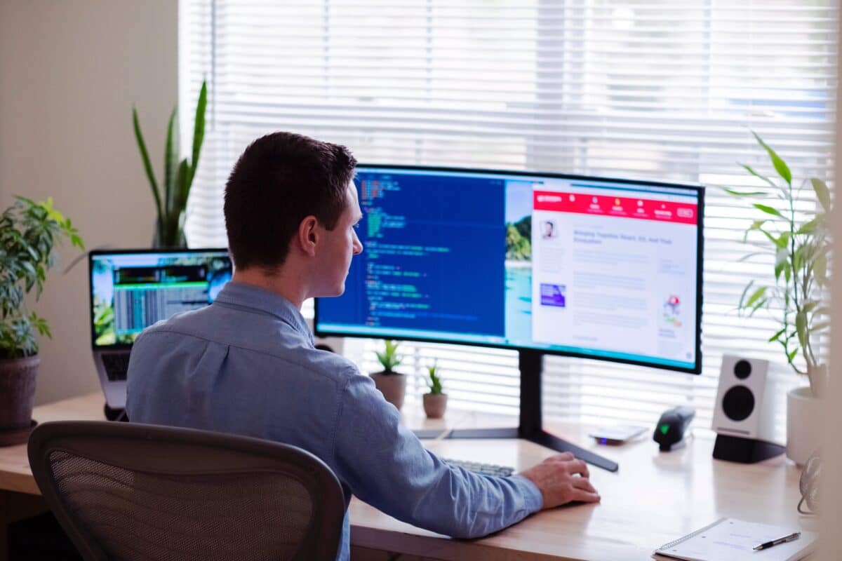 man sitting at computer looking for work